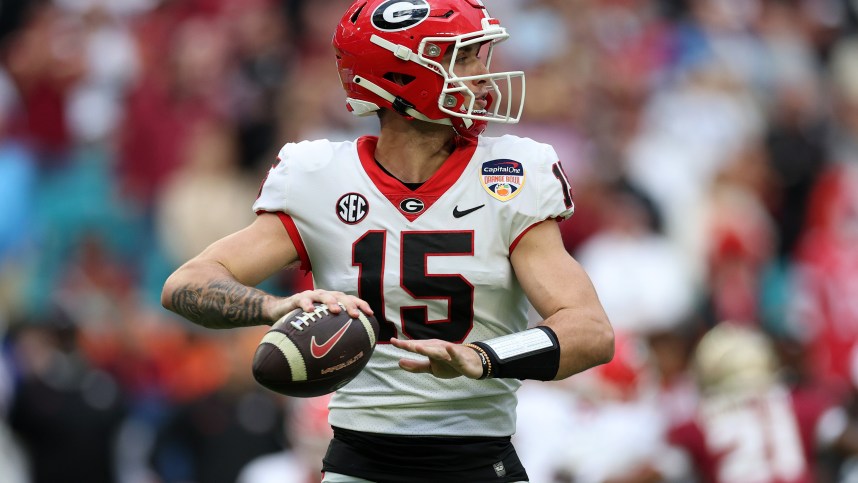 Dec 30, 2023; Miami Gardens, FL, USA; Georgia Bulldogs quarterback Carson Beck (New York Giants prospect) (15) drops back to pass against the Florida State Seminoles during the first half in the 2023 Orange Bowl at Hard Rock Stadium. Mandatory Credit: Nathan Ray Seebeck-USA TODAY Sports