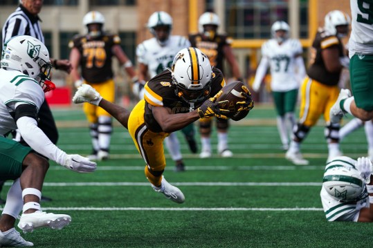 Sep 9, 2023; Laramie, Wyoming, USA; Wyoming Cowboys wide receiver Ayir Asante (5) scores a touchdown against the Portland State Vikings during the third quarter at Jonah Field at War Memorial Stadium. Mandatory Credit: Troy Babbitt-USA TODAY Sports
