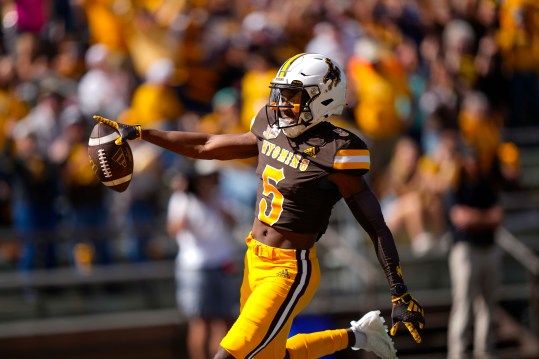 Sep 9, 2023; Laramie, Wyoming, USA; Wyoming Cowboys wide receiver Ayir Asante (5) scores a touchdown against the Portland State Vikings during the second quarter at Jonah Field at War Memorial Stadium. Mandatory Credit: Troy Babbitt-USA TODAY Sports