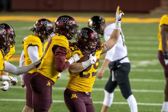 Nov 20, 2020; Minneapolis, Minnesota, USA; Minnesota Golden Gophers linebacker Josh Aune (29) celebrates with defensive back Tyler Nubin (27) after intercepting a pass in the fourth quarter against the Purdue Boilermakers at TCF Bank Stadium. Mandatory Credit: Jesse Johnson-USA TODAY Sports
