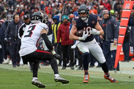 Dec 31, 2023; Chicago, Illinois, USA; Chicago Bears tight end Robert Tonyan (New York Giants FA target) (18) makes a catch against Atlanta Falcons safety Jessie Bates III (3) during the first half at Soldier Field. Mandatory Credit: Mike Dinovo-USA TODAY Sports