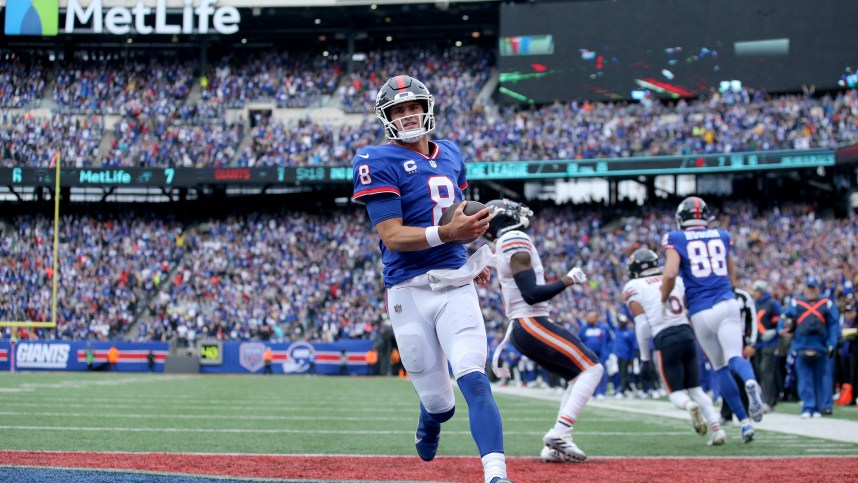 Oct 2, 2022; East Rutherford, New Jersey, USA; New York Giants quarterback Daniel Jones (8) runs for a touchdown against the Chicago Bears during the second quarter at MetLife Stadium. Mandatory Credit: Brad Penner-USA TODAY Sports