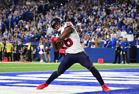 Jan 6, 2024; Indianapolis, Indiana, USA; Houston Texans running back Devin Singletary (26) celebrates after a touchdown against the Indianapolis Colts during the second half at Lucas Oil Stadium. Mandatory Credit: Marc Lebryk-USA TODAY Sports