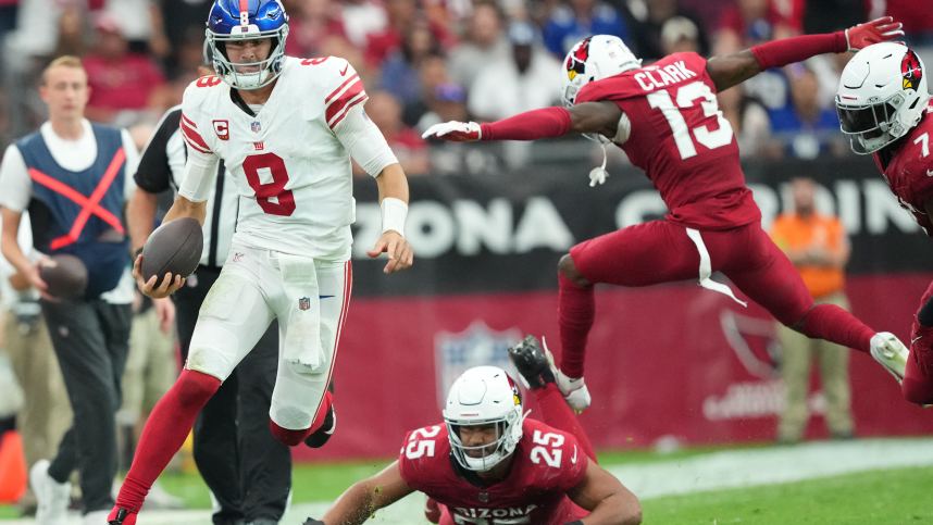 Sep 17, 2023; Glendale, Arizona, USA; New York Giants quarterback Daniel Jones (8) runs against the Arizona Cardinals during the second half at State Farm Stadium. Mandatory Credit: Joe Camporeale-USA TODAY Sports