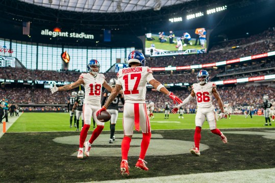 November 5, 2023; Paradise, Nevada, USA; Wide receiver Wan'Dale Robinson (17) of the New York Giants is congratulated by wide receiver Isaiah Hodgins (18) and wide receiver Darius Slayton (86) on his touchdown against the Las Vegas Raiders in the fourth quarter at Allegiant Stadium. Mandatory Photo Credit: Kyle Terada-USA TODAY Sports
