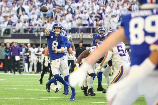 Dec 24, 2022; Minneapolis, Minnesota, USA; New York Giants quarterback Daniel Jones (8) throws a touchdown pass during the second quarter against the Minnesota Vikings at U.S. Bank Stadium. Mandatory Credit: Matt Krohn-USA TODAY Sports