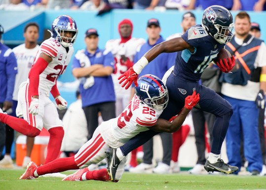 Sep 11, 2022; Nashville, Tennessee, USA; Tennessee Titans wide receiver Treylon Burks (16) picks up a first down as New York Giants cornerback Adoree' Jackson (22) tries to tackle him during the third quarter at Nissan Stadium. Mandatory Credit: George Walker IV-USA TODAY Sports