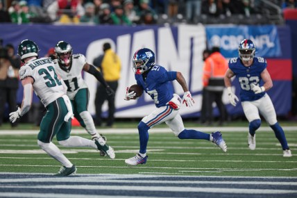 Jan 7, 2024; East Rutherford, New Jersey, USA; New York Giants wide receiver Wan'Dale Robinson (17) gains yards after catch asPhiladelphia Eagles safety Reed Blankenship (32) pursues during the first quarter at MetLife Stadium. Mandatory Credit: Vincent Carchietta-USA TODAY Sports