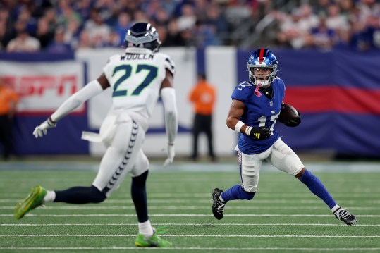 Oct 2, 2023; East Rutherford, New Jersey, USA; New York Giants wide receiver Wan'Dale Robinson (17) runs with the ball against Seattle Seahawks cornerback Riq Woolen (27) during the first quarter at MetLife Stadium. Mandatory Credit: Brad Penner-USA TODAY Sports
