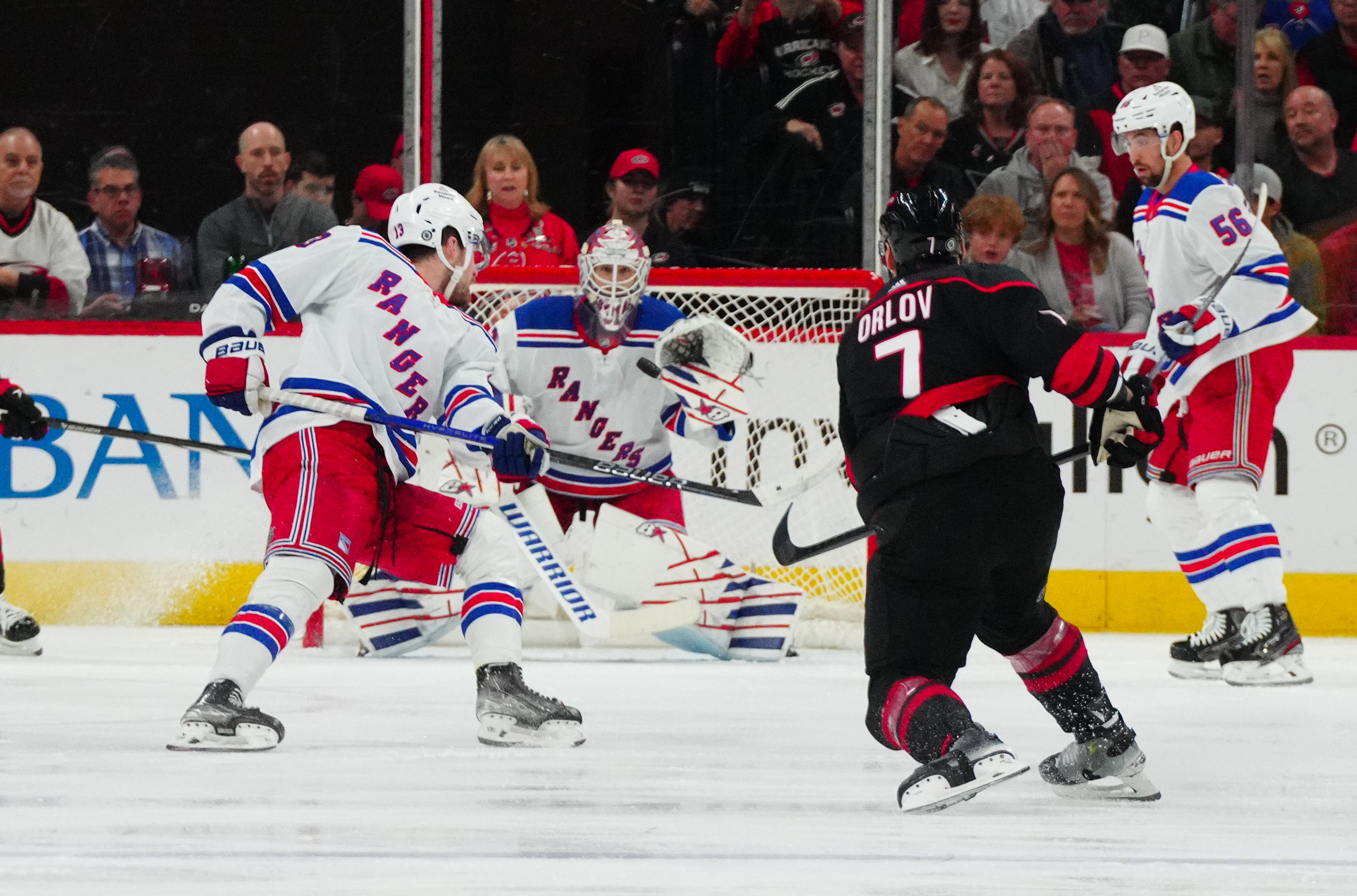 Mar 12, 2024; Raleigh, North Carolina, USA; Carolina Hurricanes defenseman Dmitry Orlov (7) takes a shot against the New York Rangers during the second period at PNC Arena. Mandatory Credit: James Guillory-USA TODAY Sports