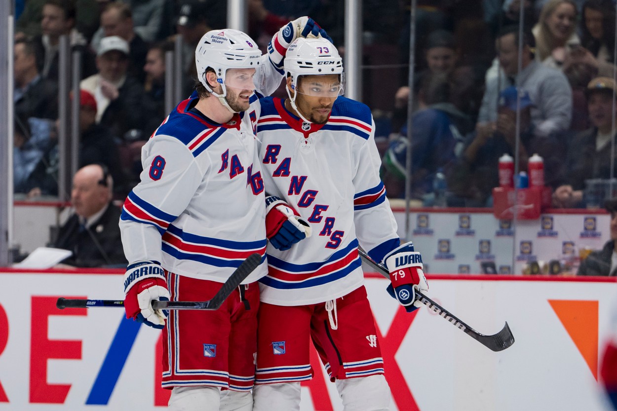 Feb 15, 2023; Vancouver, British Columbia, CAN; New York Rangers defenseman Jacob Trouba (8) celebrates defenseman K'Andre Miller (79) goal against the Vancouver Canucks in the second period at Rogers Arena. Mandatory Credit: Bob Frid-USA TODAY Sports