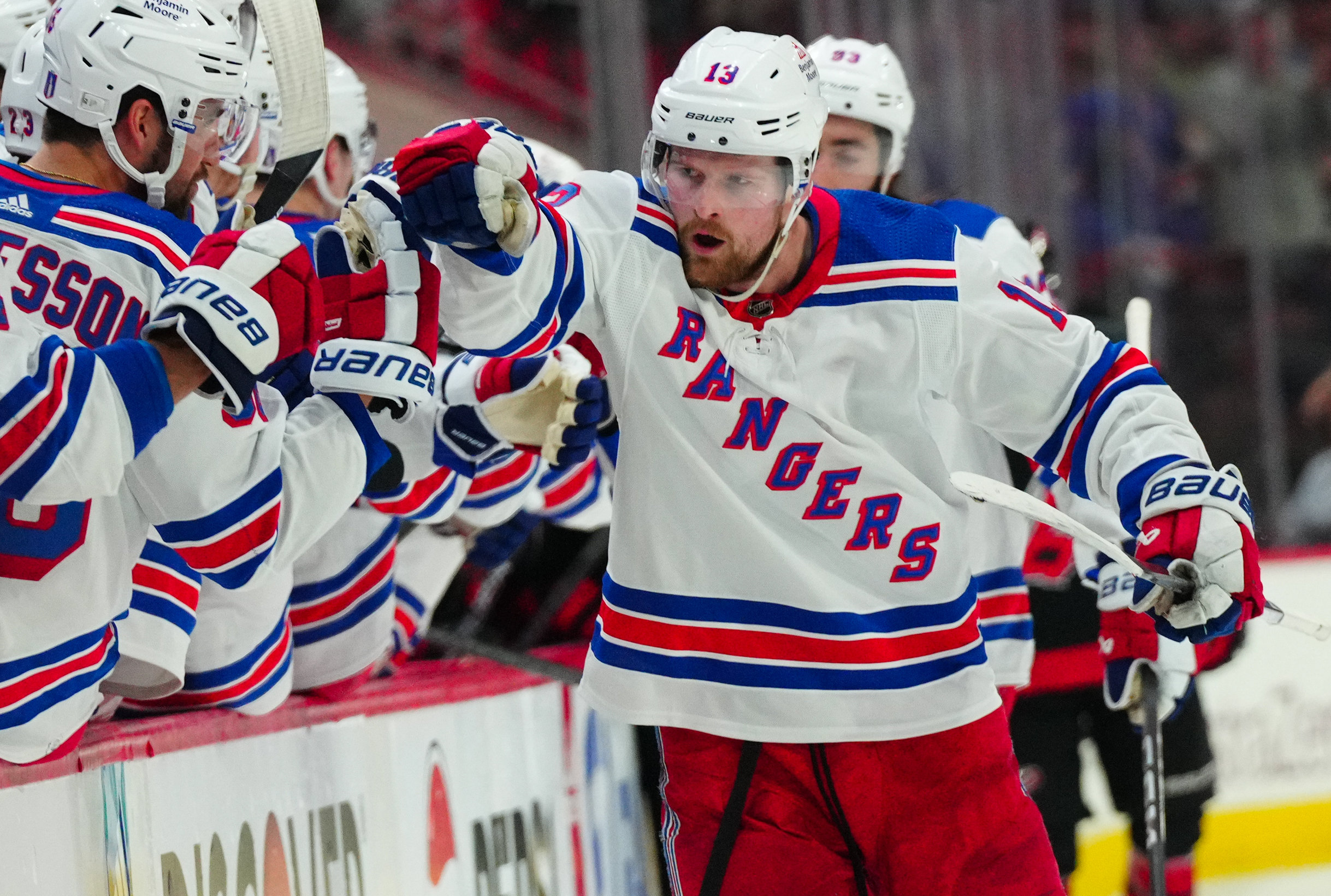 May 11, 2024; Raleigh, North Carolina, USA; New York Rangers left wing Alexis Lafrenière (13) celebrates after scoring a goal against the Carolina Hurricanes during the third period in game four of the second round of the 2024 Stanley Cup Playoffs at PNC Arena. Mandatory Credit: James Guillory-USA TODAY Sports