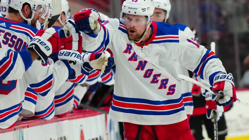 May 11, 2024; Raleigh, North Carolina, USA; New York Rangers left wing Alexis Lafrenière (13) celebrates after scoring a goal against the Carolina Hurricanes during the third period in game four of the second round of the 2024 Stanley Cup Playoffs at PNC Arena. Mandatory Credit: James Guillory-USA TODAY Sports