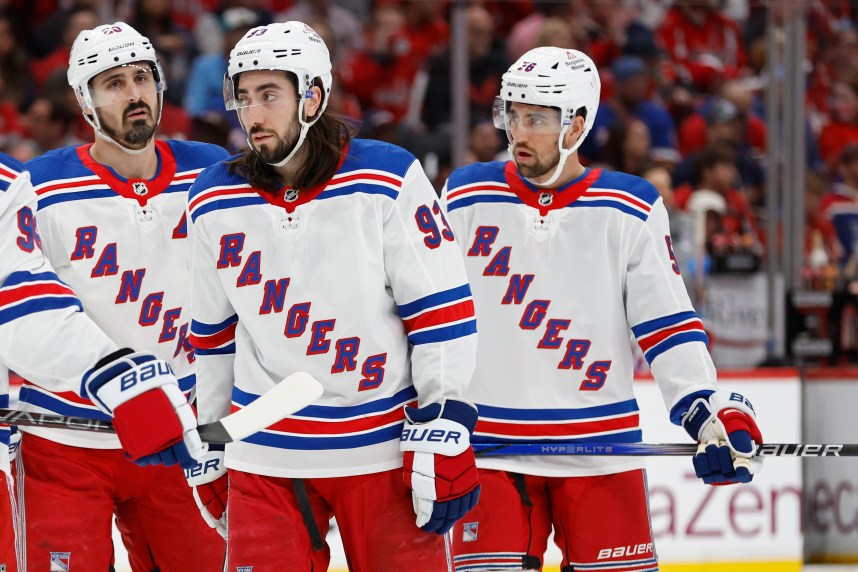 Apr 26, 2024; Washington, District of Columbia, USA; New York Rangers center Mika Zibanejad (93), Rangers left wing Chris Kreider (20), and Rangers defenseman Erik Gustafsson (56) stand on the ice during a stoppage in play against the Washington Capitals in the second period in game three of the first round of the 2024 Stanley Cup Playoffs at Capital One Arena. Mandatory Credit: Geoff Burke-USA TODAY Sports