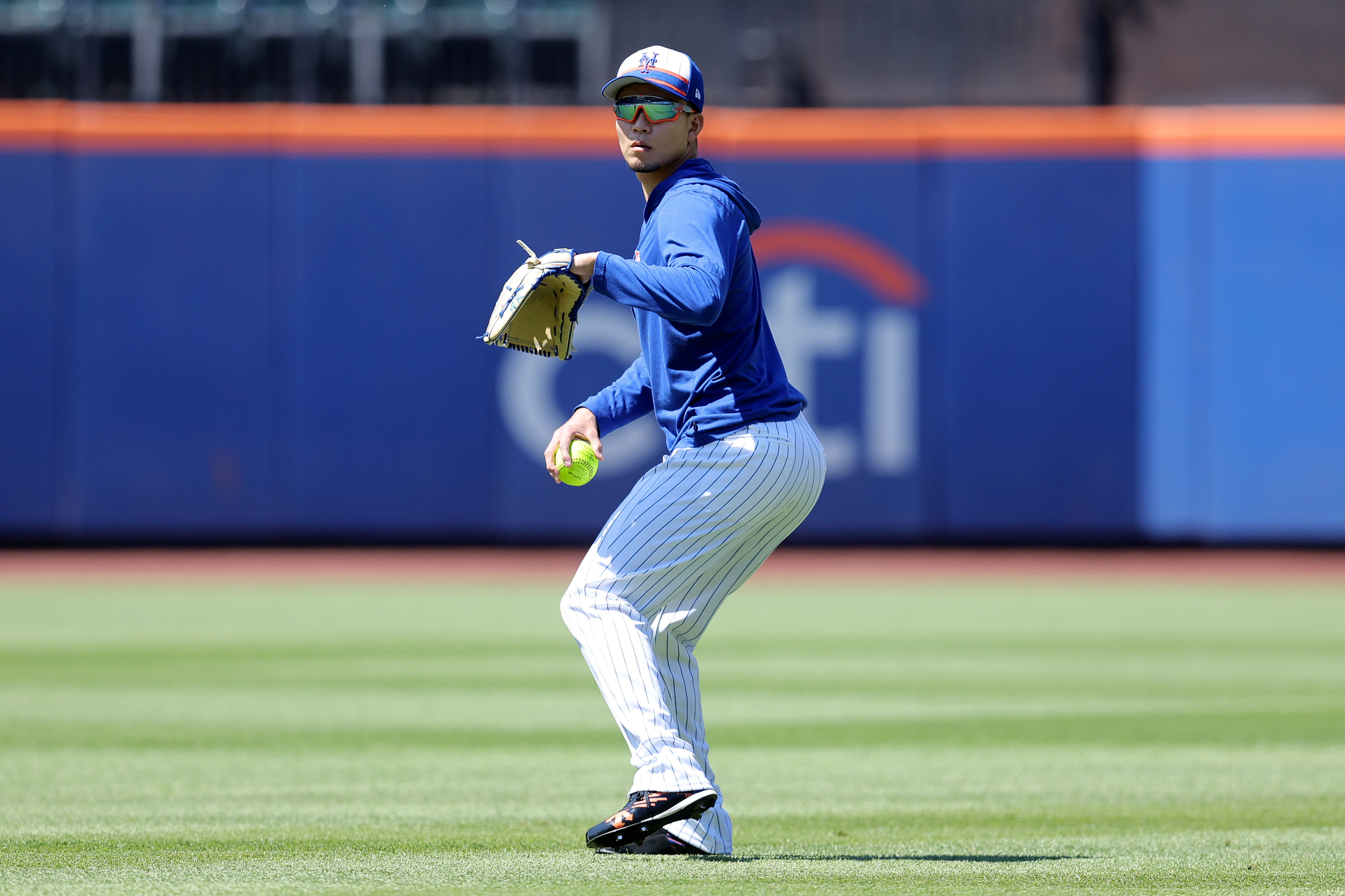 Jun 1, 2024; New York City, New York, USA; New York Mets injured starting pitcher Kodai Senga (34) throws a softball in the outfield before a game against the Arizona Diamondbacks at Citi Field. Mandatory Credit: Brad Penner-USA TODAY Sports