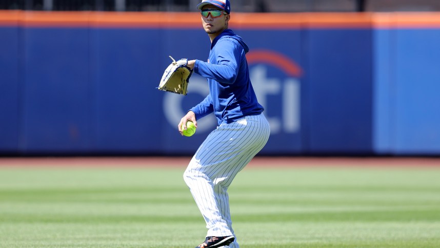 Jun 1, 2024; New York City, New York, USA; New York Mets injured starting pitcher Kodai Senga (34) throws a softball in the outfield before a game against the Arizona Diamondbacks at Citi Field. Mandatory Credit: Brad Penner-USA TODAY Sports