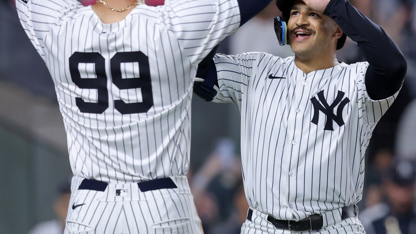 Jun 9, 2024; Bronx, New York, USA; New York Yankees center fielder Trent Grisham (12) celebrates his three run home run against the Los Angeles Dodgers with right fielder Aaron Judge (99) during the sixth inning at Yankee Stadium. Mandatory Credit: Brad Penner-USA TODAY Sports