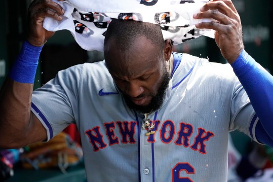 June 21, 2024; Chicago, Illinois, USA; New York Mets outfielder Starling Marte (6) cools off in the dugout against the Chicago Cubs during the seventh inning at Wrigley Field. Mandatory Photo Credit: David Banks-USA TODAY Sports