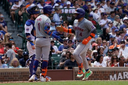 Jun 22, 2024; Chicago, Illinois, USA; New York Mets catcher Francisco Alvarez (4) is greeted by second baseman Jeff McNeil (1) after hitting a home run against the Chicago Cubs during the fifth inning at Wrigley Field. Mandatory Credit: David Banks-USA TODAY Sports