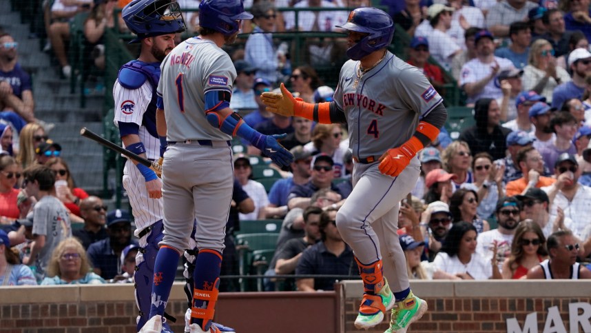 Jun 22, 2024; Chicago, Illinois, USA; New York Mets catcher Francisco Alvarez (4) is greeted by second baseman Jeff McNeil (1) after hitting a home run against the Chicago Cubs during the fifth inning at Wrigley Field. Mandatory Credit: David Banks-USA TODAY Sports