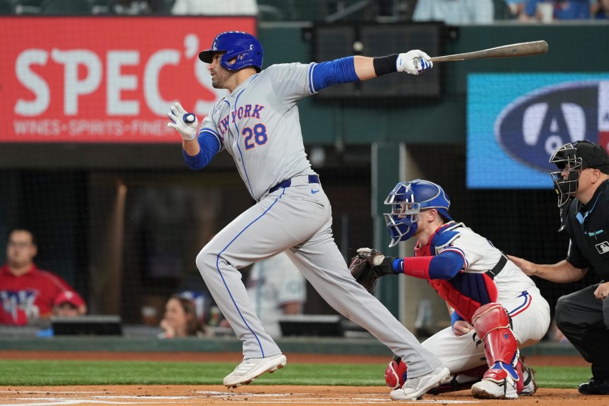 Jun 17, 2024; Arlington, Texas, USA; New York Mets designated hitter J.D. Martinez (28) follows through on his single against the Texas Rangers during the first inning at Globe Life Field. Mandatory Credit: Jim Cowsert-USA TODAY Sports