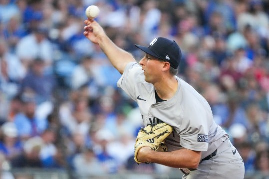 Jun 12, 2024; Kansas City, Missouri, USA;  New York Yankees starting pitcher Cody Poteet (72) delivers a pitch against the Kansas City Royals in the first inning at Kauffman Stadium. Mandatory Credit: Denny Medley-USA TODAY Sports