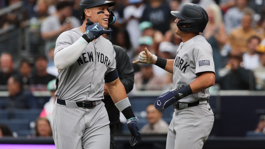 May 25, 2024; San Diego, California, USA; New York Yankees center fielder Aaron Judge (99)celebrates with shortstop Anthony Volpe (11) after a two run home run in the first inning against the San Diego Padres at Petco Park. Mandatory Credit: Chadd Cady-USA TODAY Sports