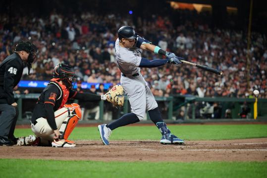 Jun 1, 2024; San Francisco, California, USA; New York Yankees outfielder Aaron Judge (99) hits a single against the San Francisco Giants during the eighth inning at Oracle Park. Mandatory Credit: Robert Edwards-USA TODAY Sports