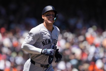 Jun 2, 2024; San Francisco, California, USA; New York Yankees center fielder Aaron Judge (99) jogs to first base after drawing a walk against the San Francisco Giants during the third inning at Oracle Park. Mandatory Credit: Darren Yamashita-USA TODAY Sports