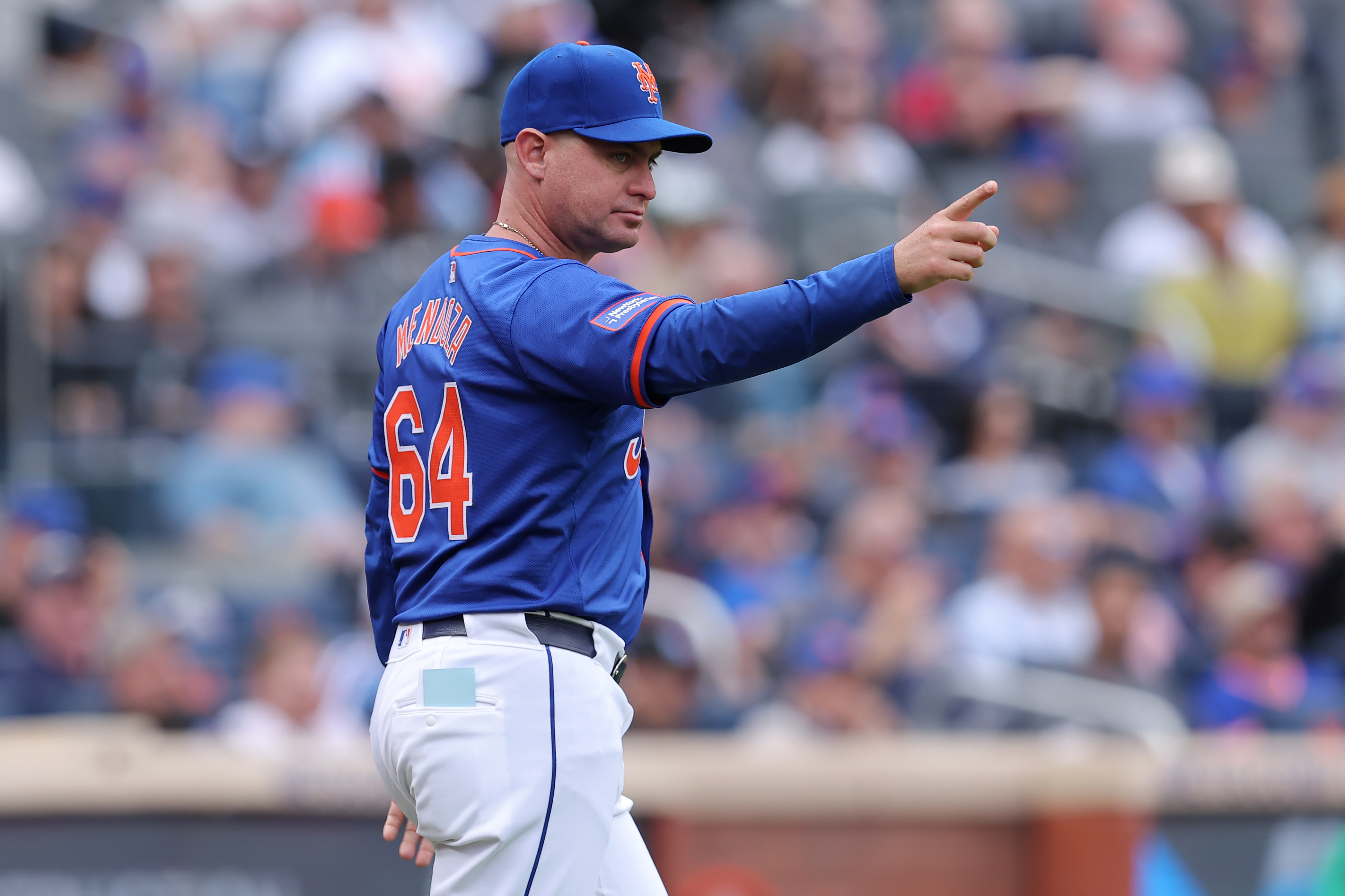 May 14, 2024; New York City, New York, USA; New York Mets manager Carlos Mendoza (64) makes a pitching change during the seventh inning against the Philadelphia Phillies at Citi Field. Mandatory Credit: Brad Penner-USA TODAY Sports