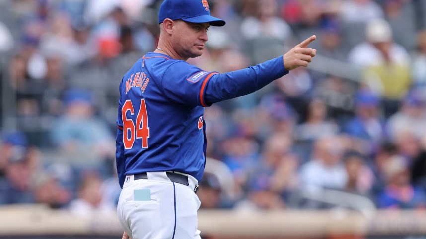 May 14, 2024; New York City, New York, USA; New York Mets manager Carlos Mendoza (64) makes a pitching change during the seventh inning against the Philadelphia Phillies at Citi Field. Mandatory Credit: Brad Penner-USA TODAY Sports