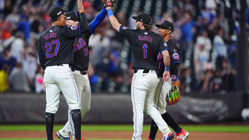 Jun 14, 2024; New York City, New York, USA; New York Mets third baseman Mark Vientos (27) and second baseman Jeff McNeil (1) and shortstop Francisco Lindor (12) and first baseman Pete Alonso (20) celebrate the victory together after the ninth inning against the San Diego Padres at Citi Field. Mandatory Credit: Gregory Fisher-USA TODAY Sports