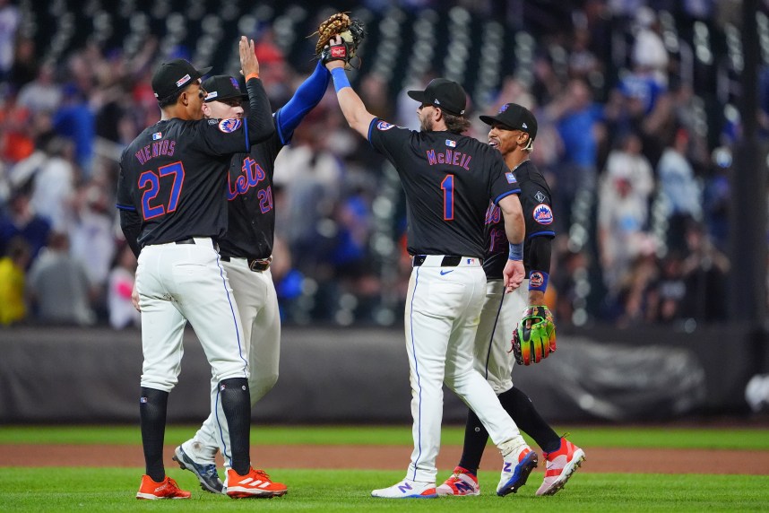Jun 14, 2024; New York City, New York, USA; New York Mets third baseman Mark Vientos (27) and second baseman Jeff McNeil (1) and shortstop Francisco Lindor (12) and first baseman Pete Alonso (20) celebrate the victory together after the ninth inning against the San Diego Padres at Citi Field. Mandatory Credit: Gregory Fisher-USA TODAY Sports