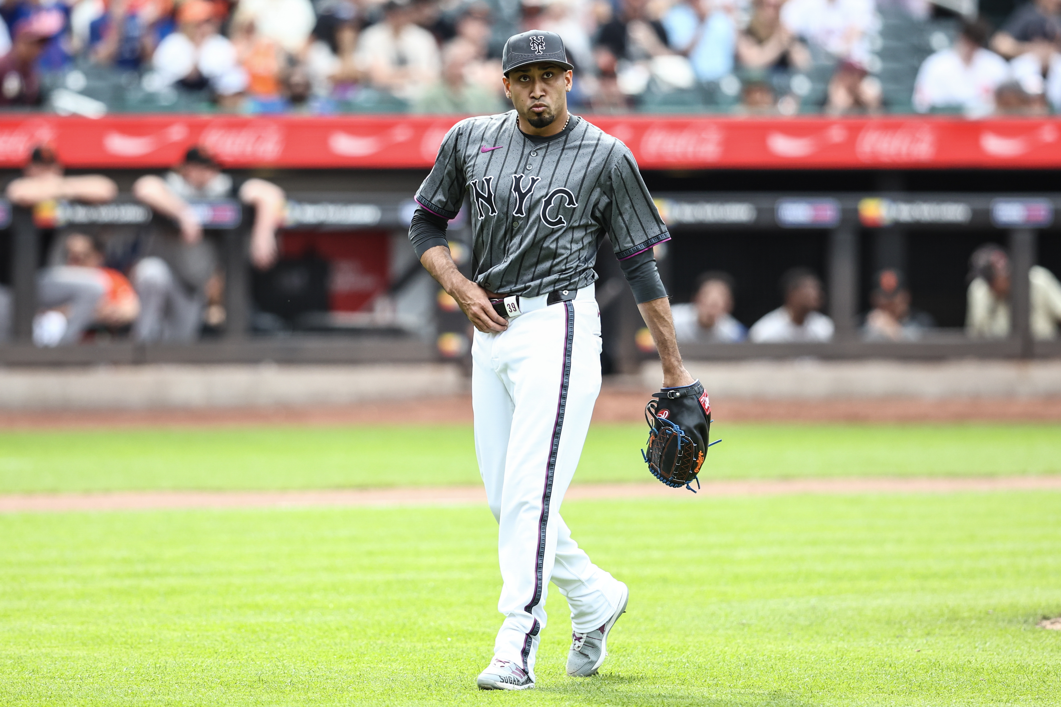 May 25, 2024; New York City, New York, USA;  New York Mets pitcher Edwin Díaz (39) walks off the mound after blowing the save in the ninth inning against the San Francisco Giants at Citi Field. Mandatory Credit: Wendell Cruz-USA TODAY Sports