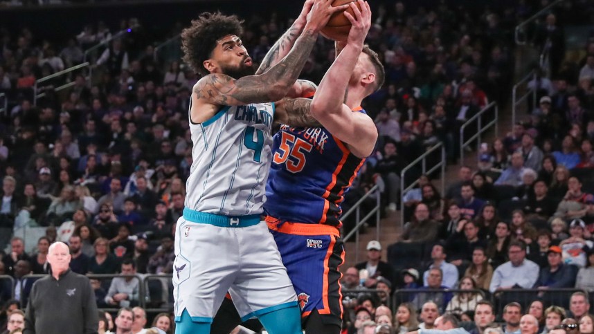 Nov 12, 2023; New York, New York, USA;  Charlotte Hornets center Nick Richards (4) and New York Knicks center Isaiah Hartenstein (55) fight for a rebound in the third quarter at Madison Square Garden. Mandatory Credit: Wendell Cruz-USA TODAY Sports