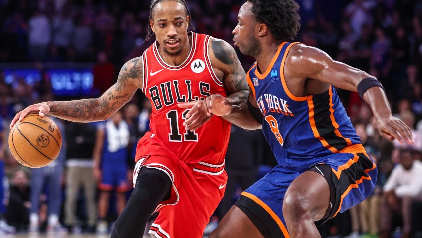 Apr 14, 2024; New York, New York, USA;  Chicago Bulls forward DeMar DeRozan (11) looks to drive past New York Knicks forward OG Anunoby (8) in the fourth quarter at Madison Square Garden. Mandatory Credit: Wendell Cruz-USA TODAY Sports