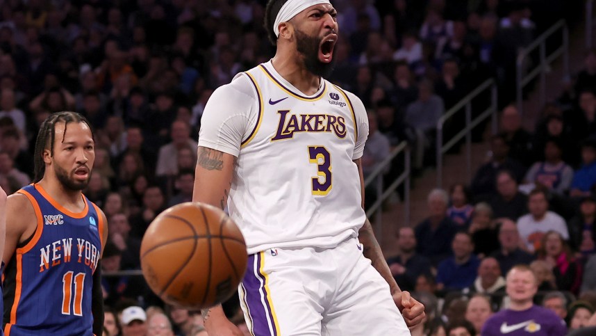 Feb 3, 2024; New York, New York, USA; Los Angeles Lakers forward Anthony Davis (3) reacts after a dunk against New York Knicks guard Jalen Brunson (11) during the first quarter at Madison Square Garden. Mandatory Credit: Brad Penner-USA TODAY Sports