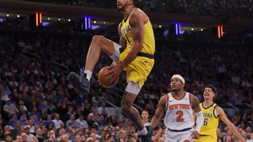 May 6, 2024; New York, New York, USA; Indiana Pacers forward Obi Toppin (1) dunks against New York Knicks guard Miles McBride (2) during the third quarter of game one of the second round of the 2024 NBA playoffs at Madison Square Garden. Mandatory Credit: Brad Penner-USA TODAY Sports