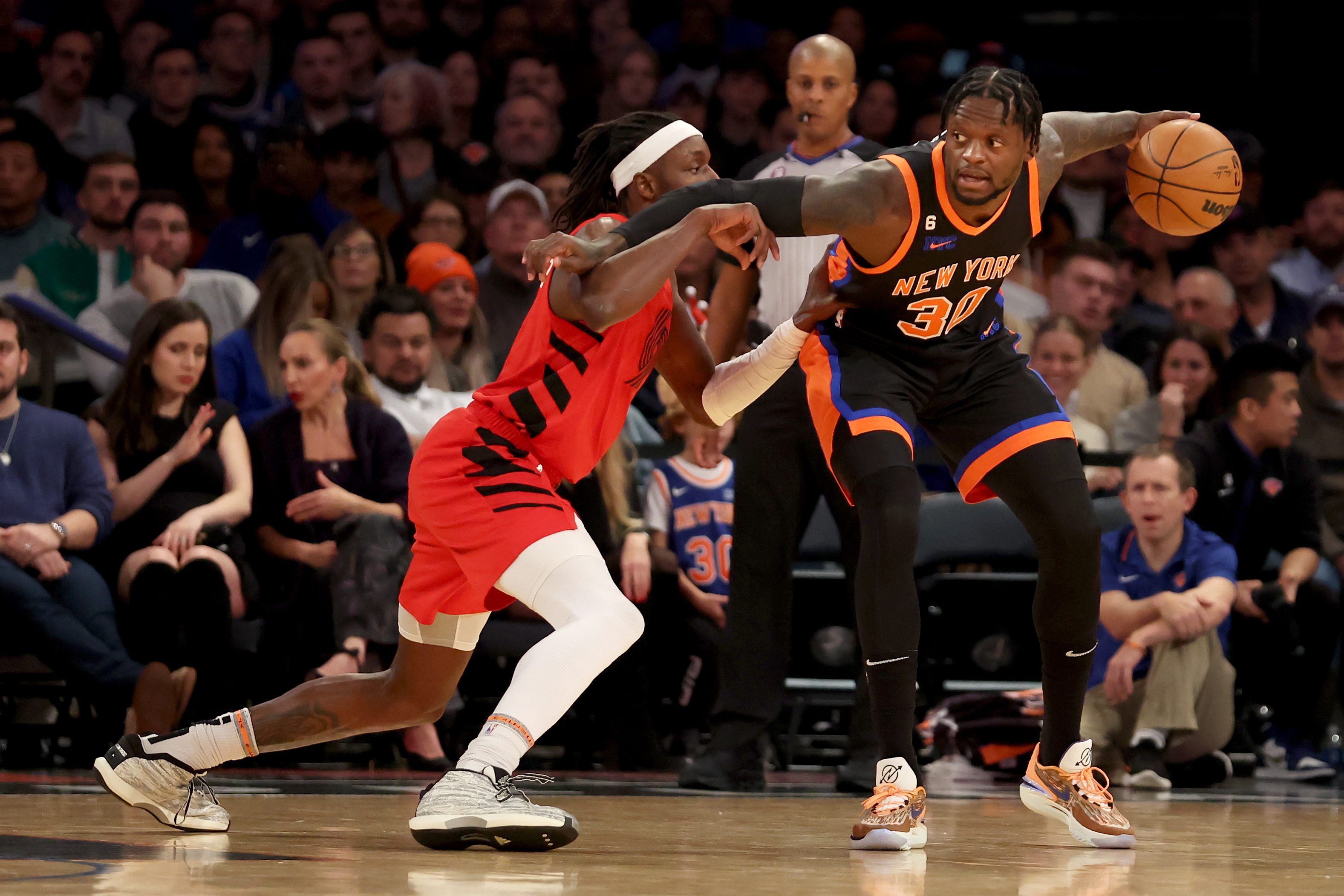 Nov 25, 2022; New York, New York, USA; New York Knicks forward Julius Randle (30) controls the ball against Portland Trail Blazers forward Jerami Grant (9) during the first quarter at Madison Square Garden. Mandatory Credit: Brad Penner-USA TODAY Sports