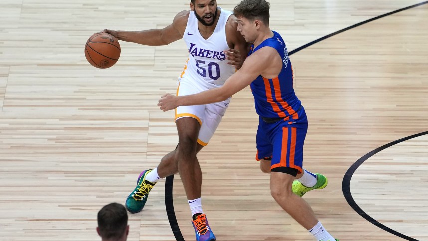 Aug 11, 2021; Las Vegas, Nevada, USA; Los Angeles Lakers forward Yoeli Childs (50) dribbles against New York Knicks guard Rokas Jokubaitis (0) during an NBA Summer League game at Thomas & Mack Center. Mandatory Credit: Stephen R. Sylvanie-USA TODAY Sports