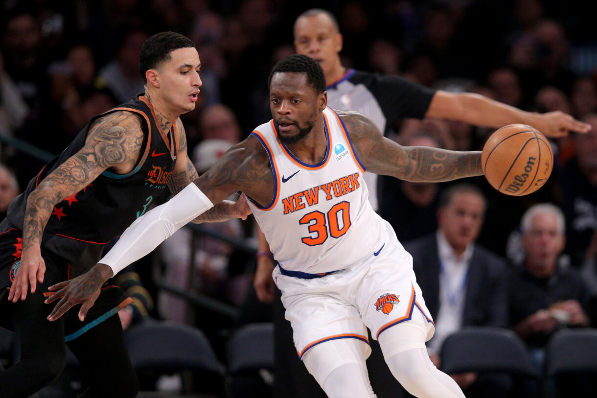 Jan 18, 2024; New York, New York, USA; New York Knicks forward Julius Randle (30) controls the ball against Washington Wizards forward Kyle Kuzma (33) during the third quarter at Madison Square Garden. Mandatory Credit: Brad Penner-USA TODAY Sports