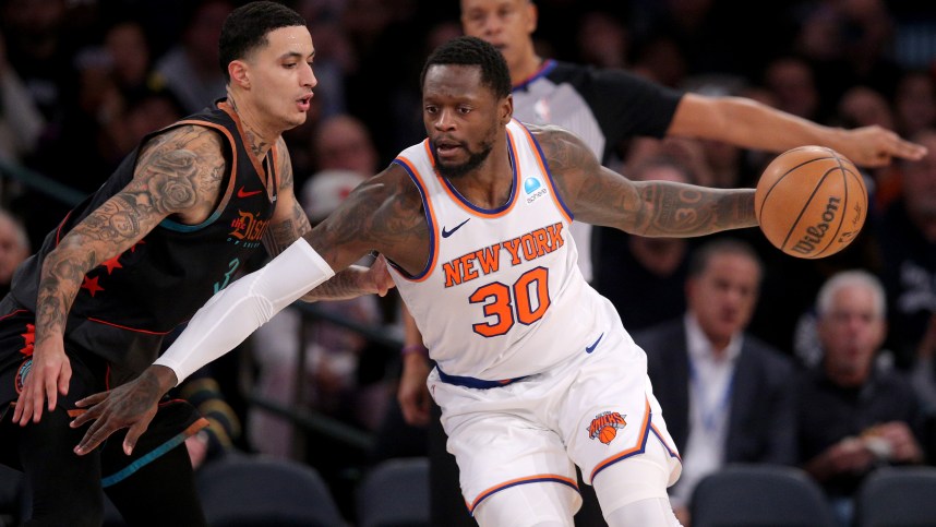 Jan 18, 2024; New York, New York, USA; New York Knicks forward Julius Randle (30) controls the ball against Washington Wizards forward Kyle Kuzma (33) during the third quarter at Madison Square Garden. Mandatory Credit: Brad Penner-USA TODAY Sports