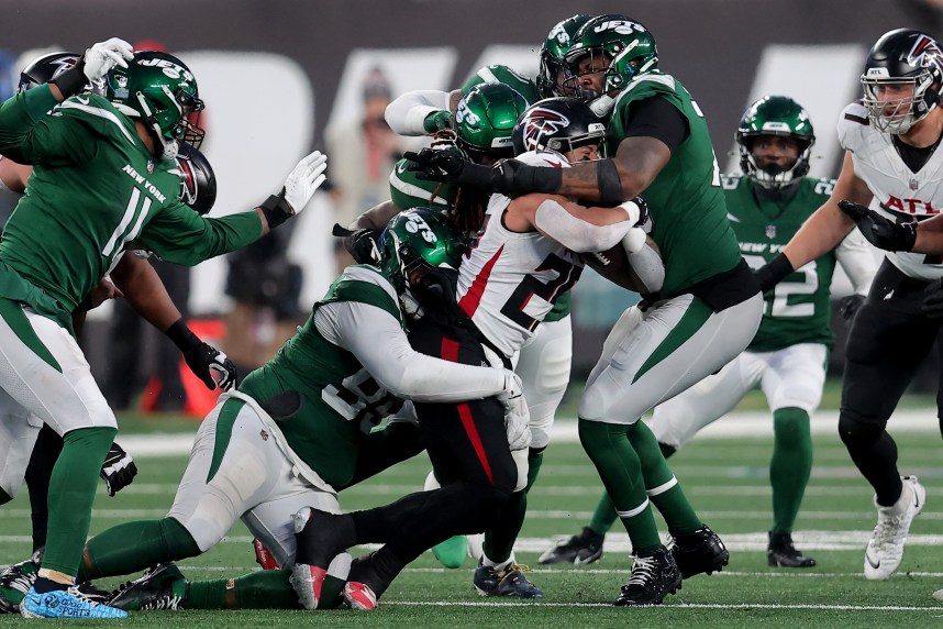 Dec 3, 2023; East Rutherford, New Jersey, USA; Atlanta Falcons running back Tyler Allgeier (25) is tackled by New York Jets defensive tackle Quinnen Williams (95) and linebacker C.J. Mosley (57) and defensive end John Franklin-Myers (91) and defensive tackle Quinton Jefferson (70) during the fourth quarter at MetLife Stadium. Mandatory Credit: Brad Penner-USA TODAY Sports