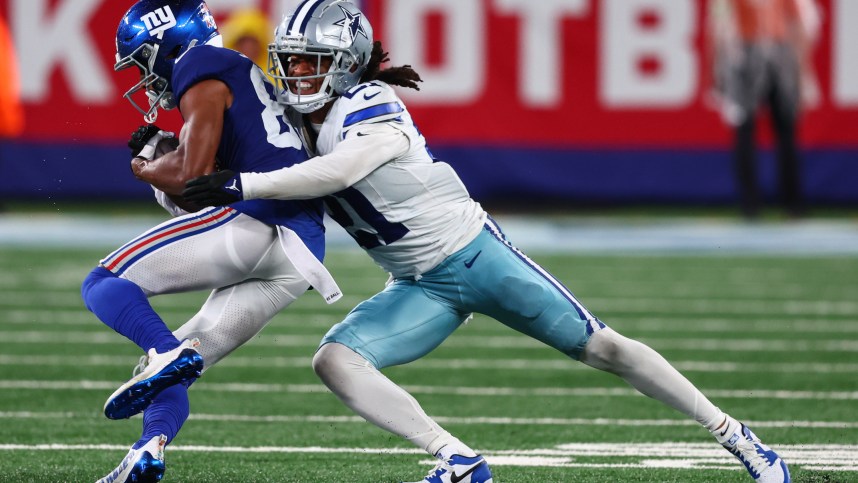 Sep 10, 2023; East Rutherford, New Jersey, USA; Dallas Cowboys cornerback Stephon Gilmore (21) tackles New York Giants wide receiver Darius Slayton (86) during the second half at MetLife Stadium. Mandatory Credit: Ed Mulholland-USA TODAY Sports