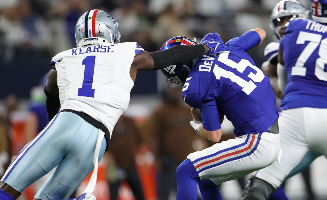 Nov 12, 2023; Arlington, Texas, USA;  New York Giants quarterback Tommy DeVito (15) avoids the sack by Dallas Cowboys safety Jayron Kearse (1) during the second quarter at AT&T Stadium. Mandatory Credit: Kevin Jairaj-USA TODAY Sports