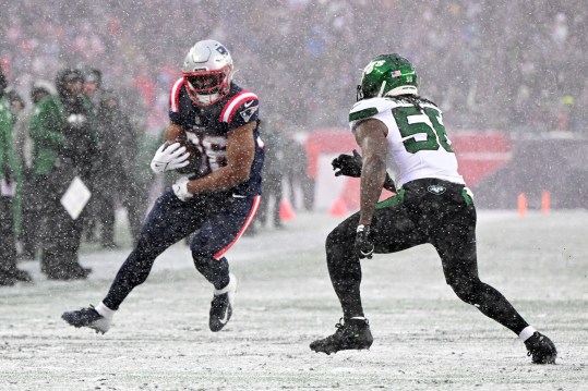 Jan 7, 2024; Foxborough, Massachusetts, USA; New England Patriots running back Kevin Harris (36) rushes against New York Jets linebacker Quincy Williams (56) during the first half at Gillette Stadium. Mandatory Credit: Brian Fluharty-USA TODAY Sports