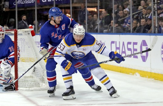 Nov 27, 2023; New York, New York, USA; New York Rangers defenseman Jacob Trouba (8) battles for the puck with Buffalo Sabres left wing Jeff Skinner (53) during the first period at Madison Square Garden. Mandatory Credit: Danny Wild-USA TODAY Sports