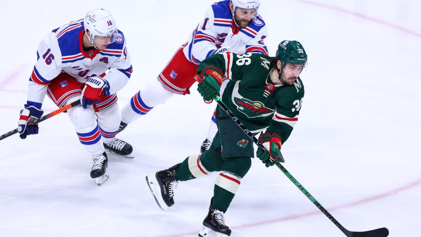 Mar 8, 2022; Saint Paul, Minnesota, USA; Minnesota Wild right wing Mats Zuccarello (36) skates with the puck as New York Rangers center Ryan Strome (16) and center Barclay Goodrow (21) defend during the third period at Xcel Energy Center. Mandatory Credit: Harrison Barden-USA TODAY Sports