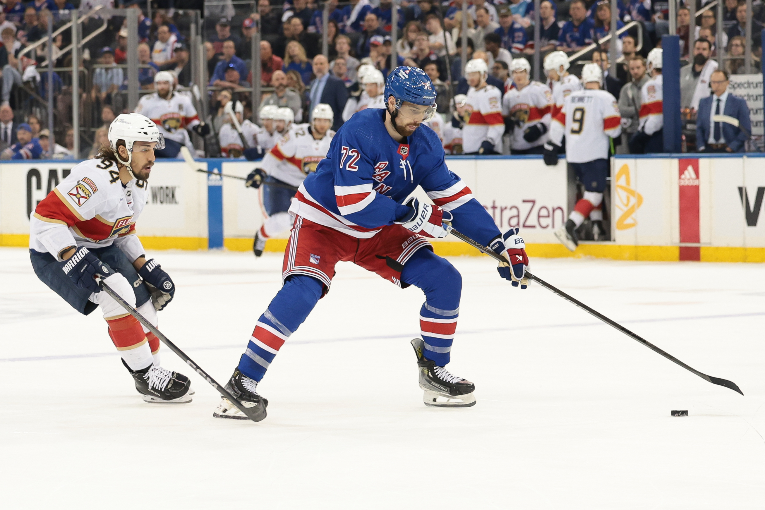 May 24, 2024; New York, New York, USA; New York Rangers center Filip Chytil (72) plays the puck in front of Florida Panthers left wing Ryan Lomberg (94) during the first period in game two of the Eastern Conference Final of the 2024 Stanley Cup Playoffs at Madison Square Garden. Mandatory Credit: Vincent Carchietta-USA TODAY Sports
