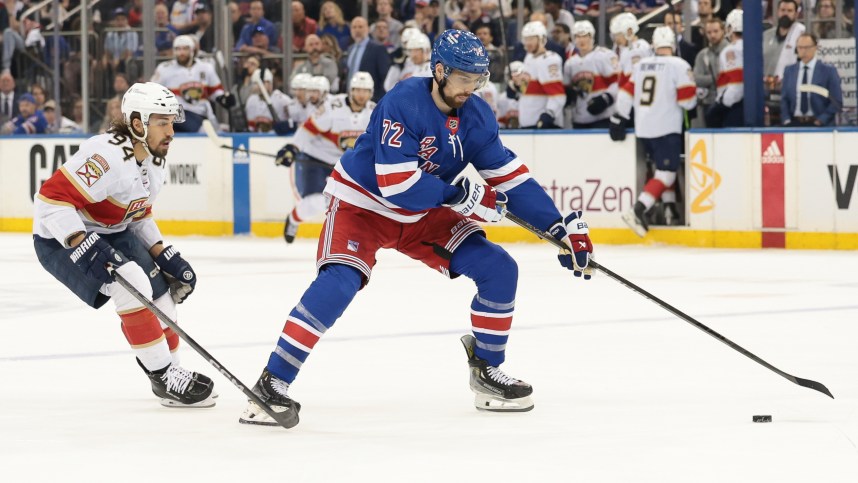 May 24, 2024; New York, New York, USA;  New York Rangers center Filip Chytil (72) plays the puck in front of Florida Panthers left wing Ryan Lomberg (94) during the first period in game two of the Eastern Conference Final of the 2024 Stanley Cup Playoffs at Madison Square Garden. Mandatory Credit: Vincent Carchietta-USA TODAY Sports